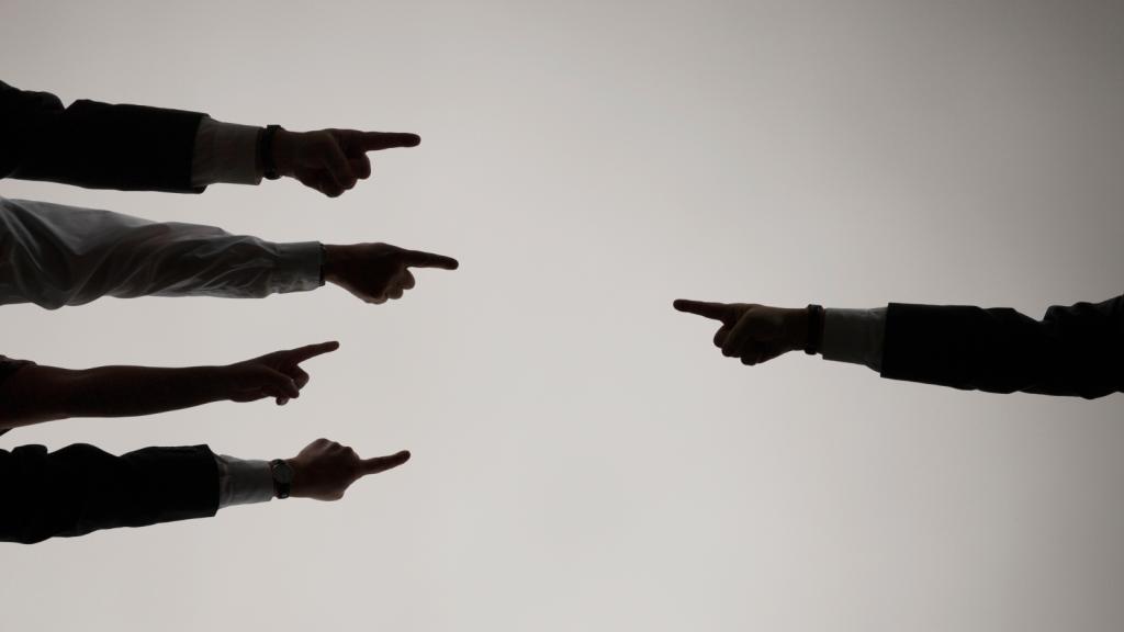 fingers pointing at one another