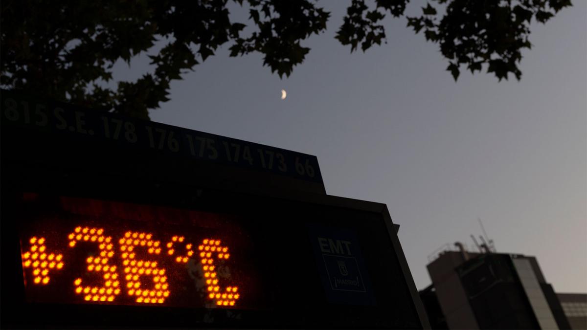A neon sign reads "36 degrees Celsius" with a night sky background against a cityscape