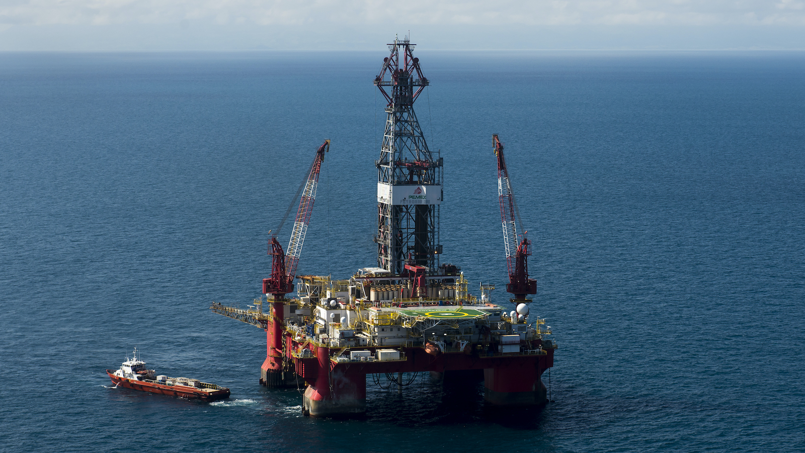 a giant piece of equipment and drill platform in the middle of the ocean