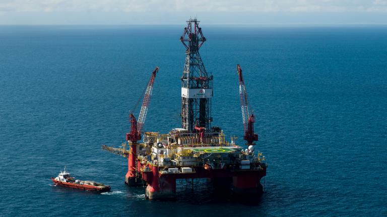 a giant piece of equipment and drill platform in the middle of the ocean
