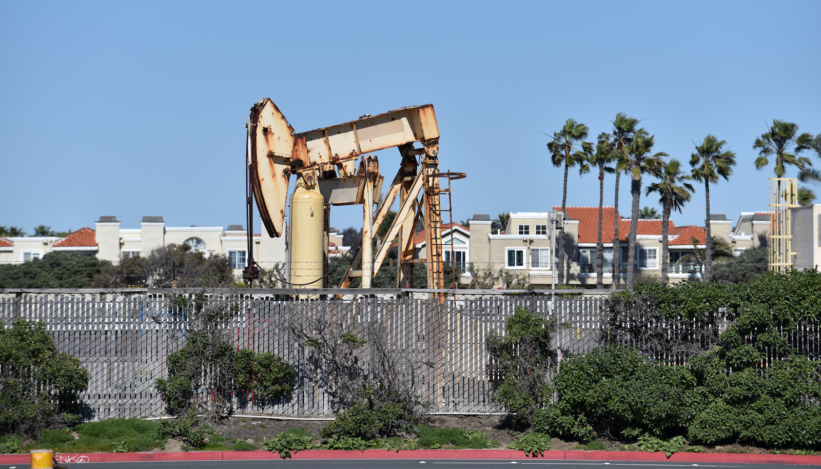 An oil pump jack in a residential area in Southern California