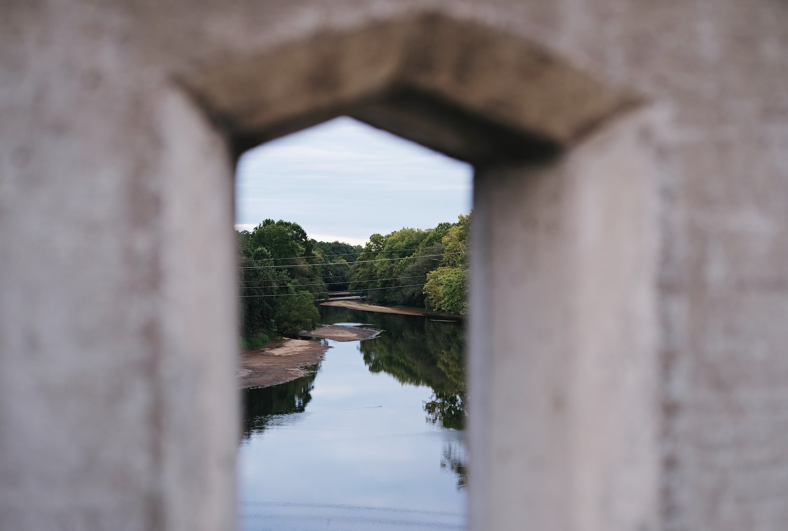 A stone window through which you can see water