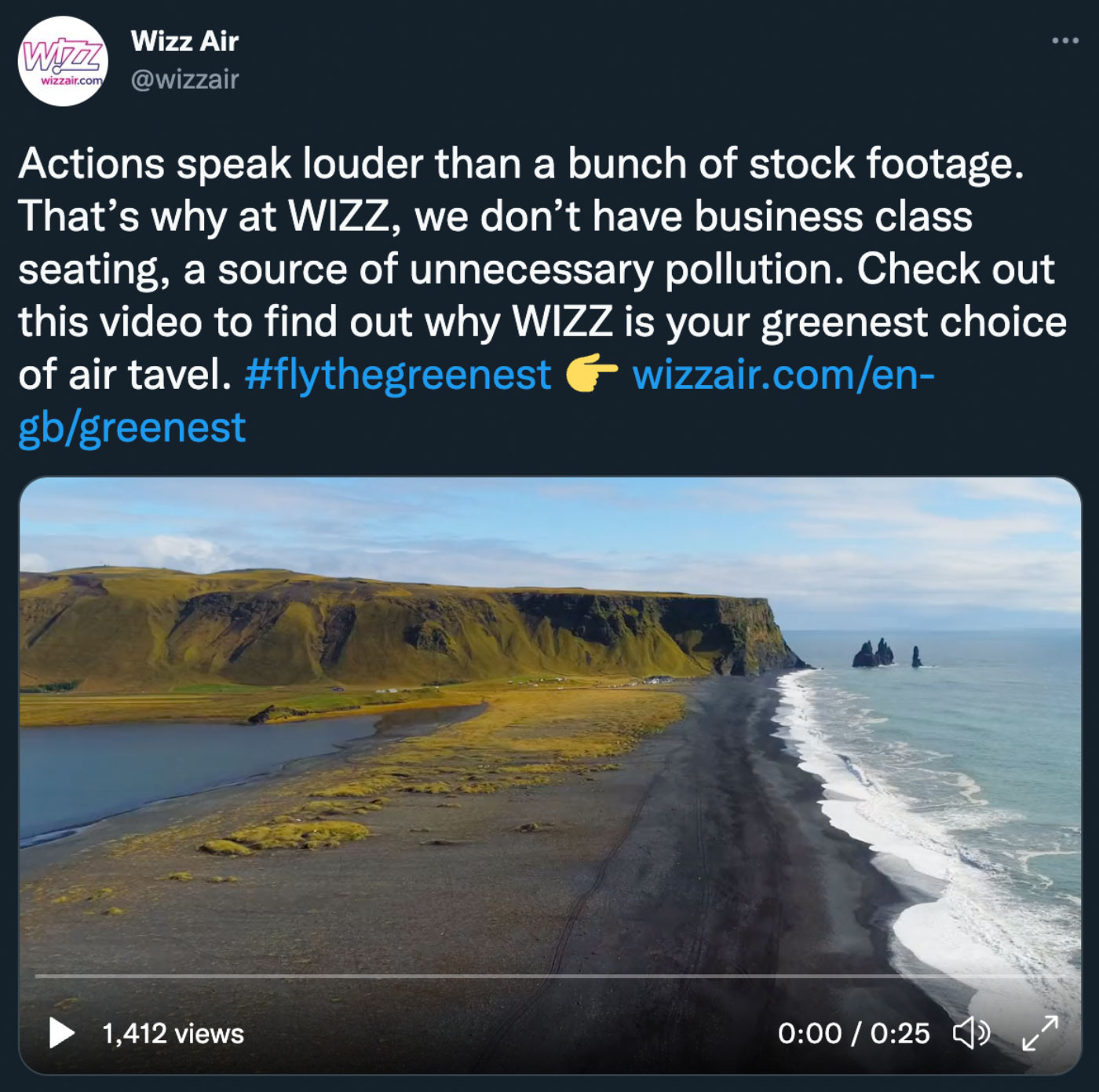 Wizz Air Twitter post with a video of a dark beach with grass covered bluffs in the distance and the ocean on the right