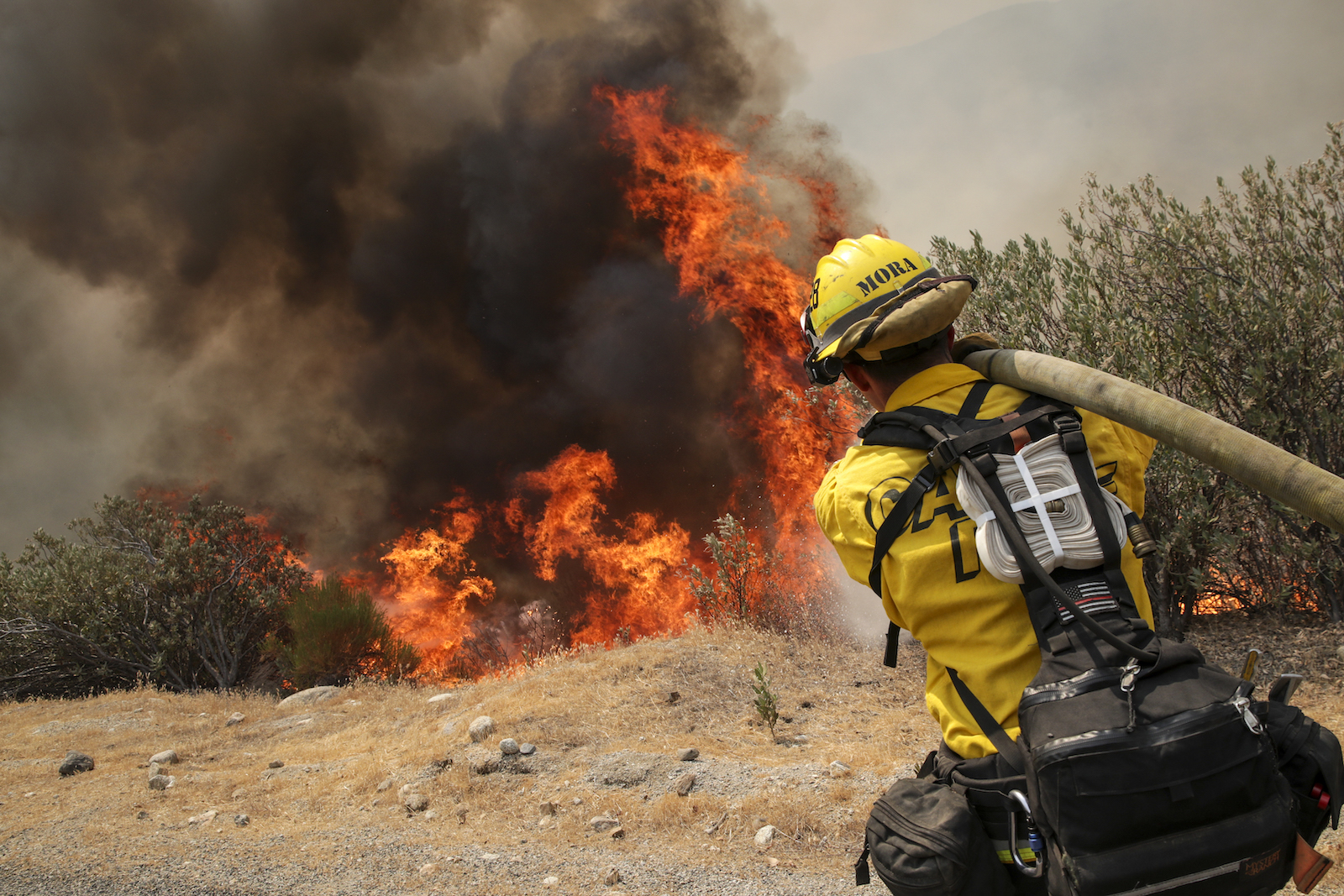 A firefighter attacks on brush fire on third day of Fairview Fire along in Bautista Canyon Road on Wednesday, Sept. 7, 2022 in Hemet, CA.