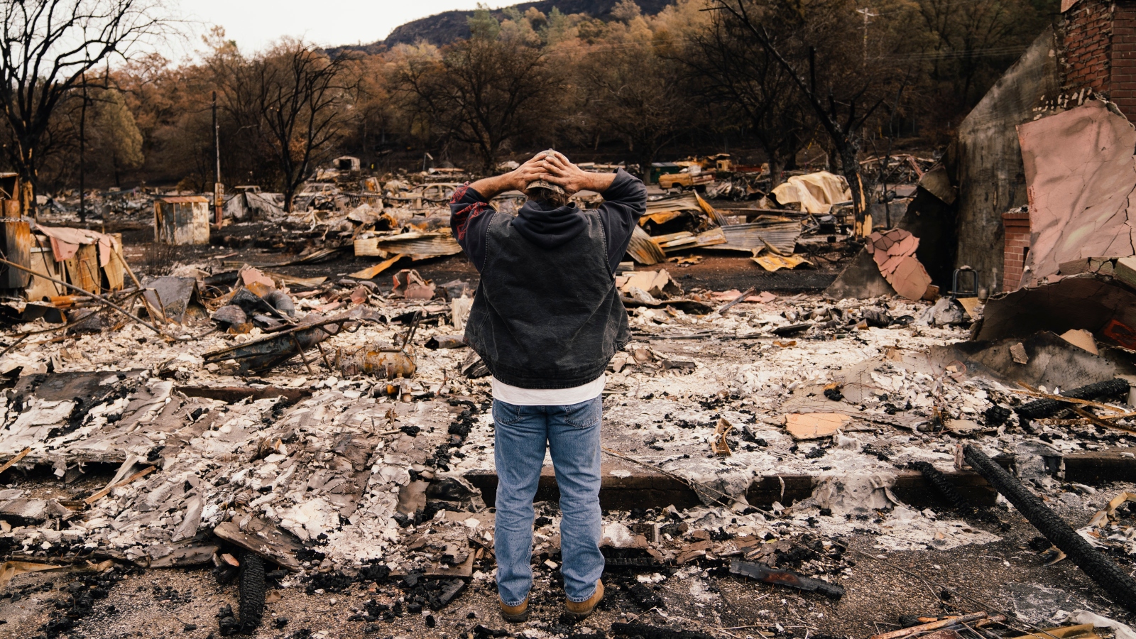 Kevin Ciotta looks over a burned out community center in Chico, California.