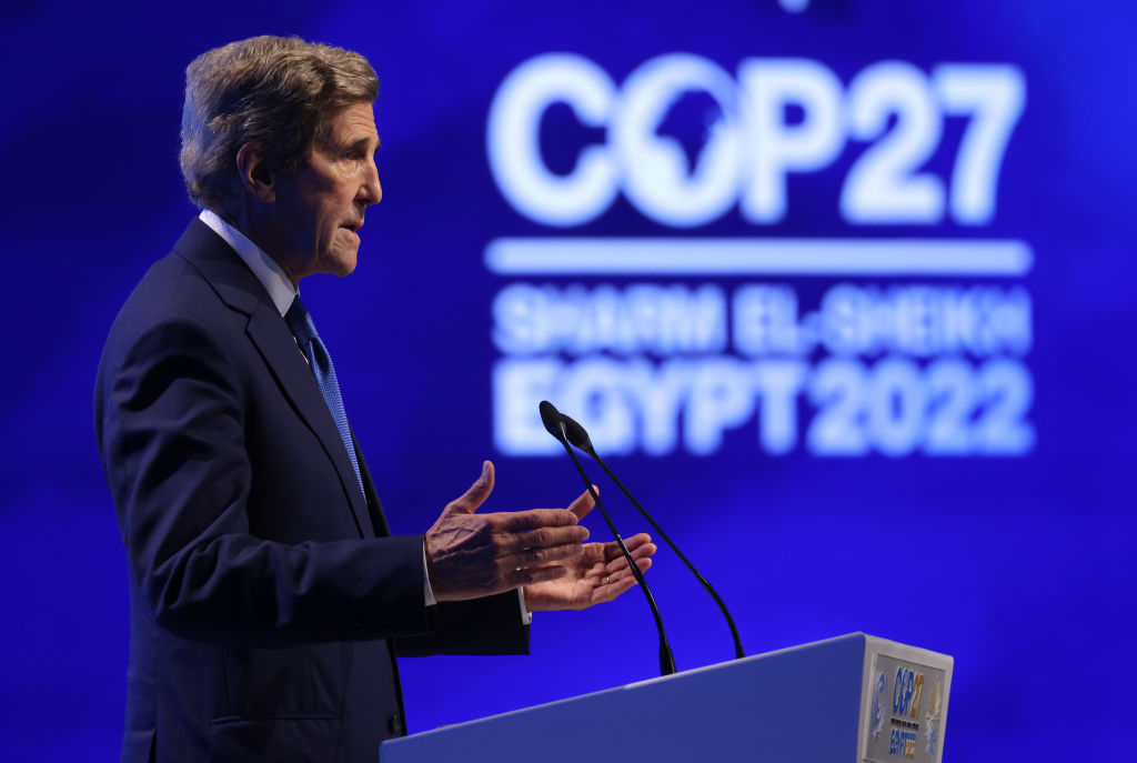 U.S. climate envoy John Kerry speaks at a podium at COP27.