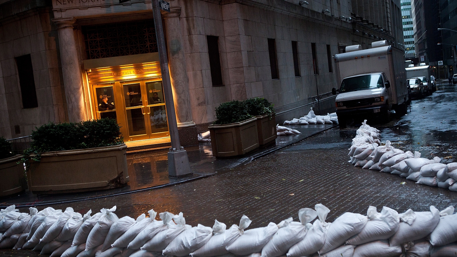 The closed New York Stock Exchange is barricaded with sand bags during the arrival of Hurricane Sandy.