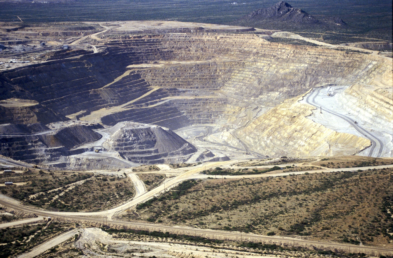 a large pit with dirt ridges as seen from the air