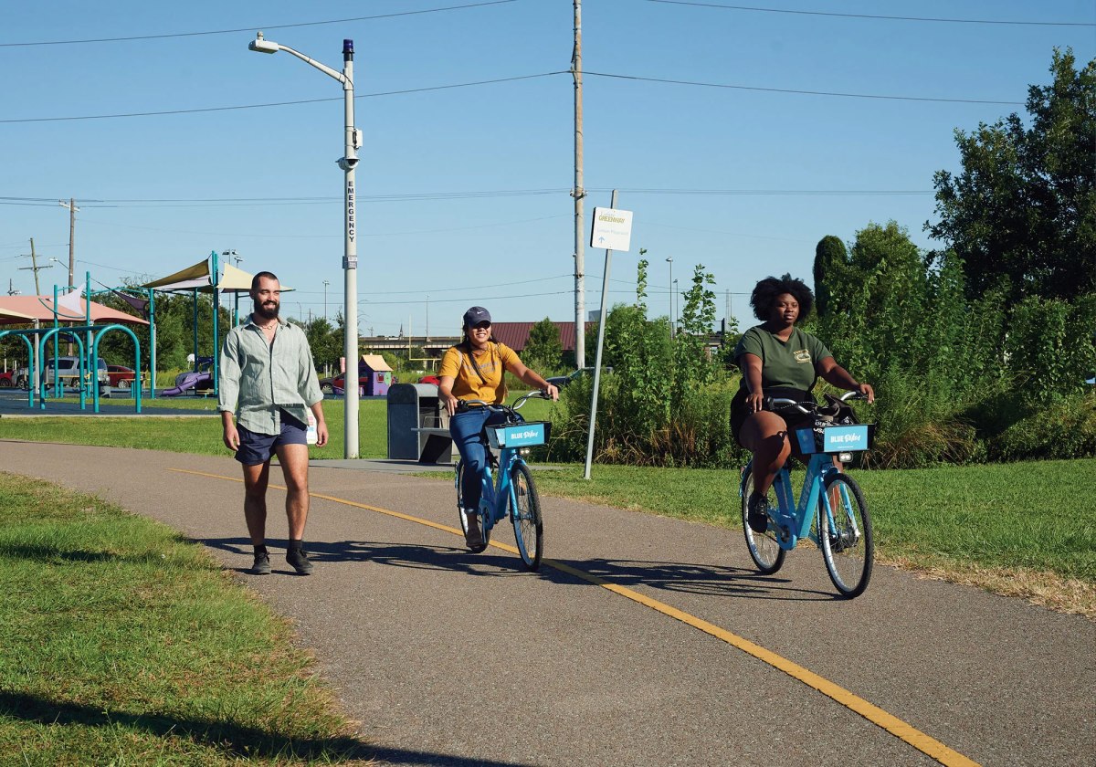 Cyclists in New Orleans take a spin on electric bicycles owned by the nonprofit bike share program Blue Bikes.