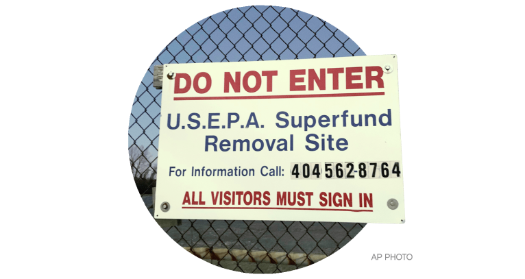 A sign identifies the Superfund removal site on the property of a former high school in Birmingham, Alabama