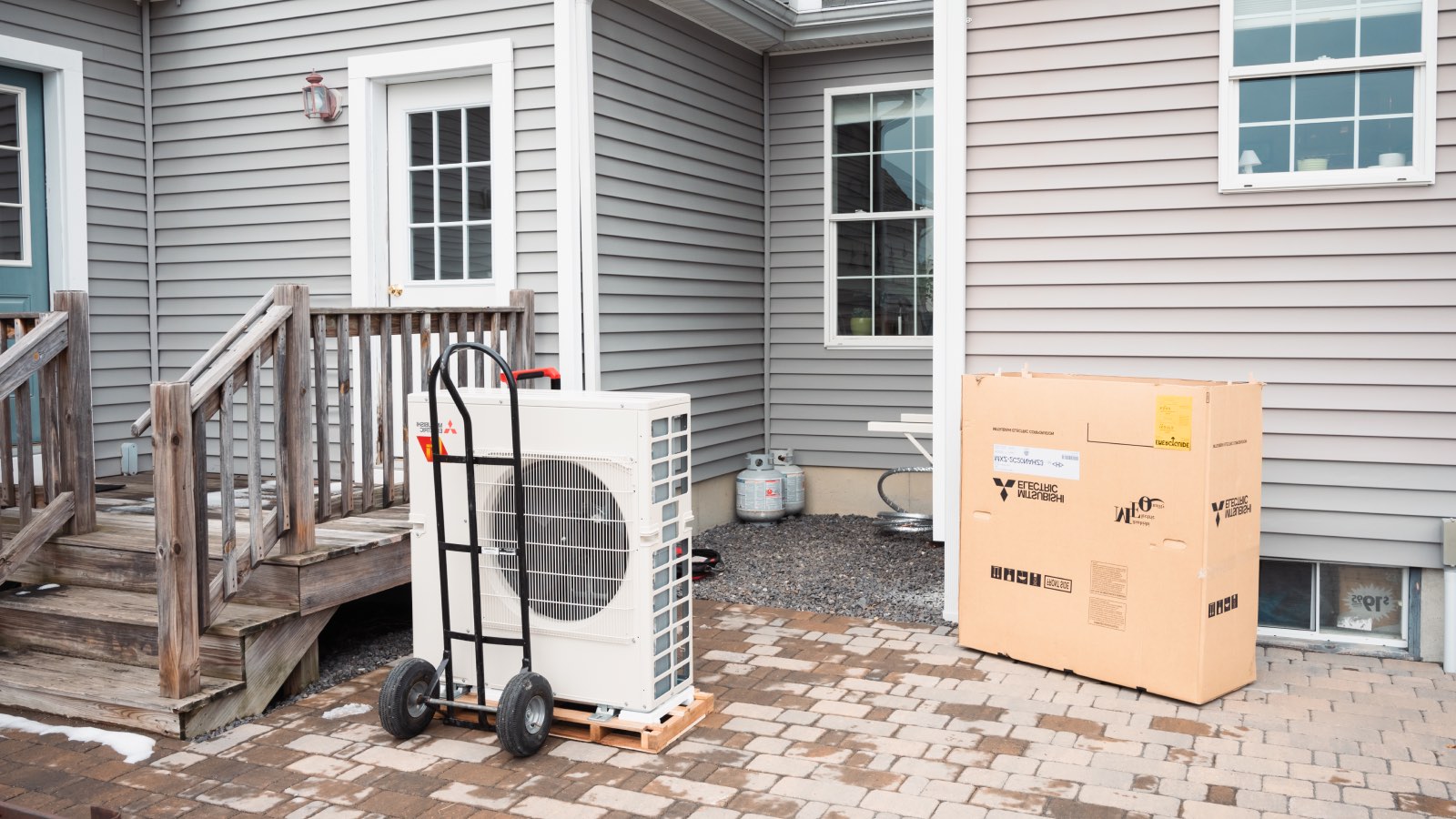 A new heat pump sits ready to be installed at a home in Windham, Maine, in January 2023.