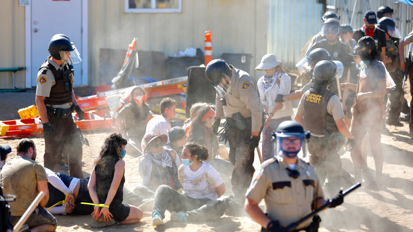 Police in riot gear arrest environmental activists at the Line 3 pipeline pumping station near the Itasca State Park, Minnesota on June 7, 2021.
