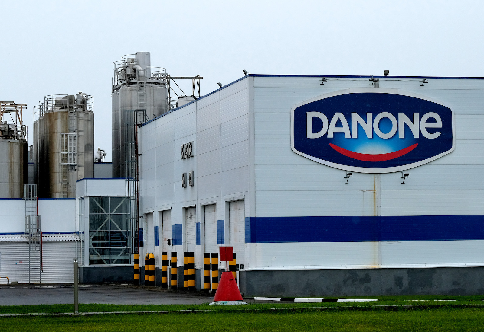 A factory with a large Danone logo