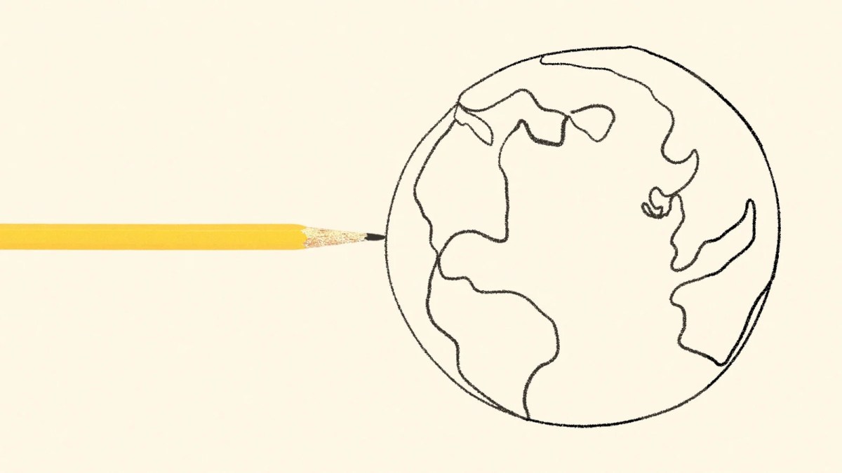 A pencil touches the circumference of a drawing of the earth