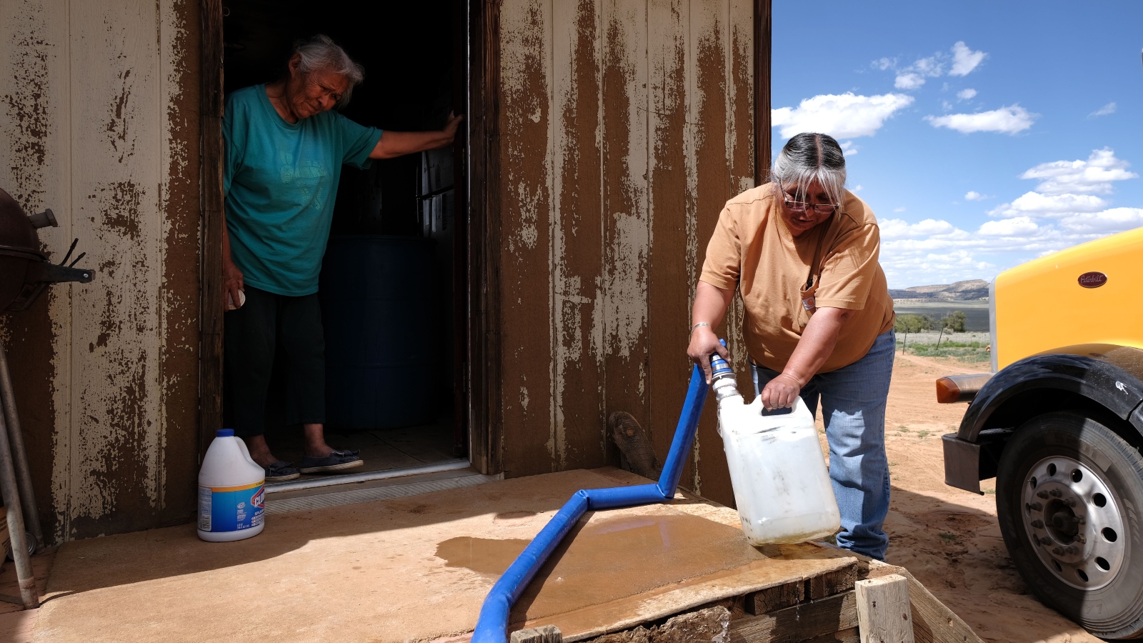 Nancy Bitsue, a member of the Navajo Nation, receives her monthly water delivery in the town of Thoreau, New Mexico. Due to disputed water rights and other factors, up to 40 percent of Navajo Nation households don’t have clean running water.