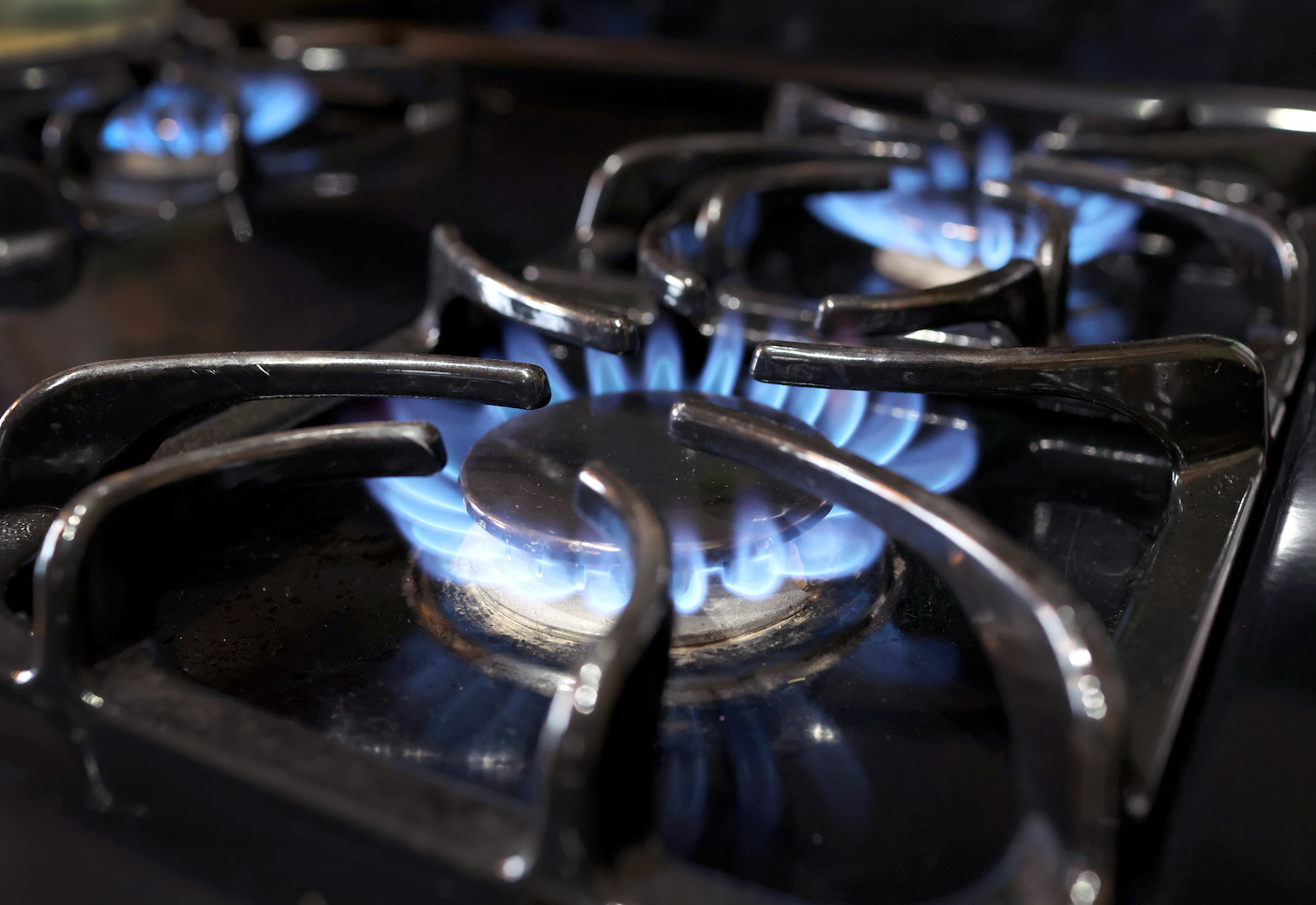 Gas stove burning with blue flame