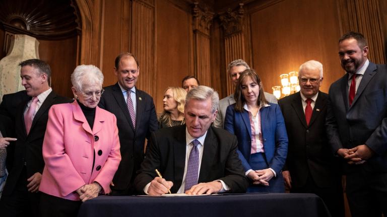 Speaker of the House Kevin McCarthy, a Republican Congressman from California, signs a resolution that would have overturned a Biden administration rule allowing retirement fund managers to consider environmental, social and governance (ESG) factors when making investment decisions at the U.S. Capitol on March 9, 2023. President Biden has vetoed the bill.
