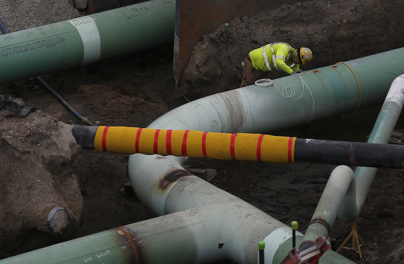 worker installing a pipeline near the weymouth compressor station