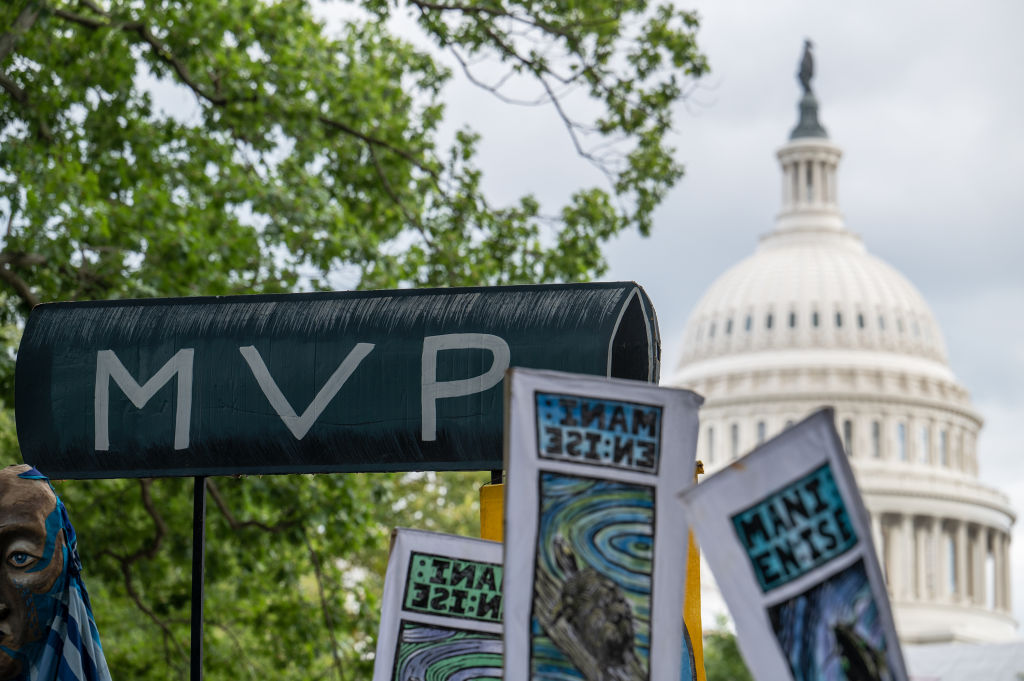 Protesters in front of Capitol with MVP sign