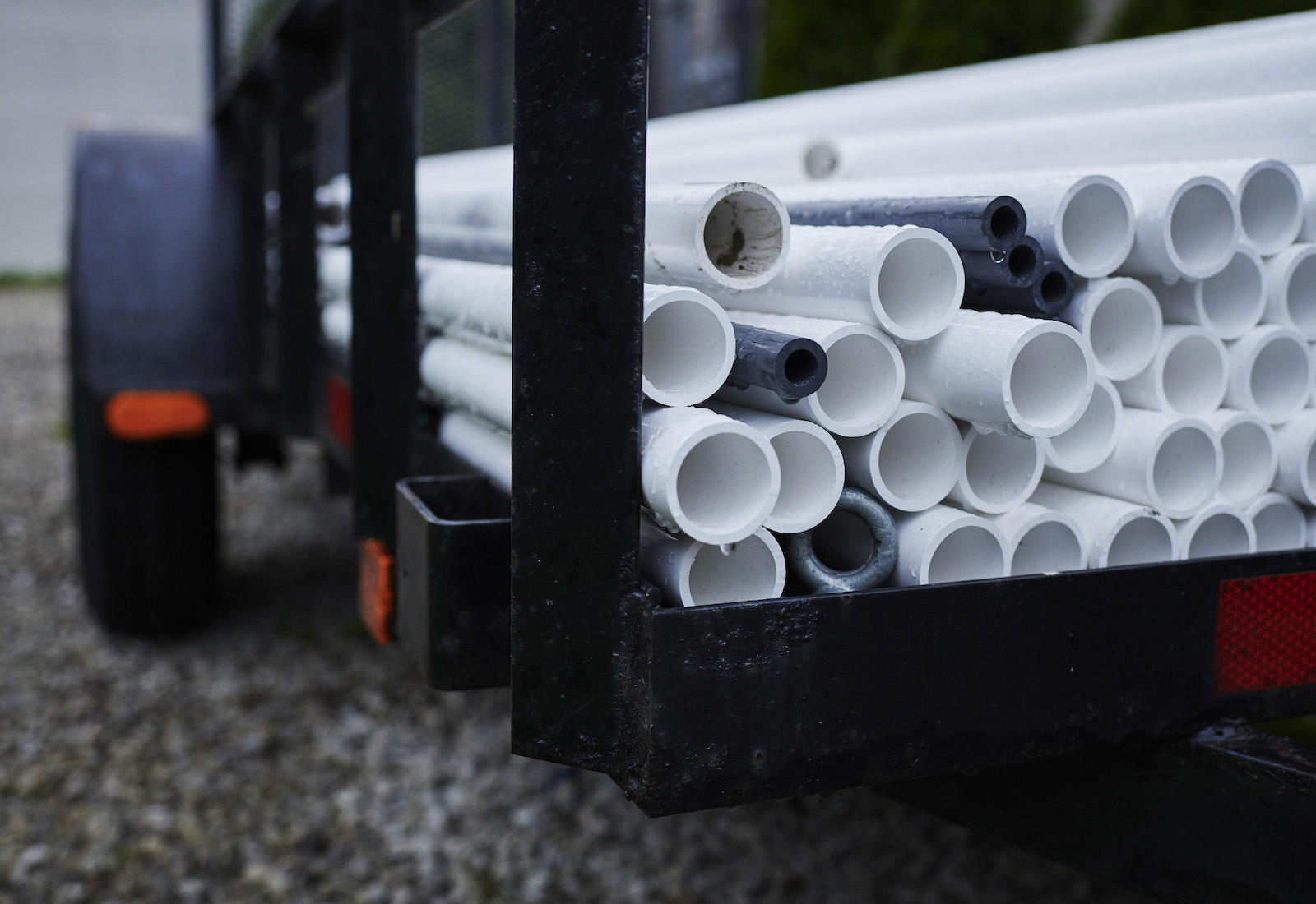 PVC pipes stacked in the back of a truck