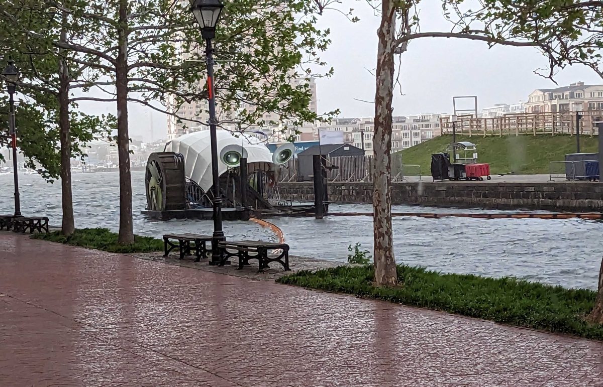 An image of Mr. Trash Wheel as a storm rolls in on his birthday.