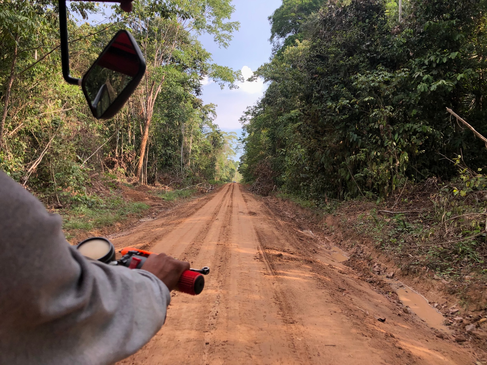A motorbike navigating a dirt road near Caimito in Peru.