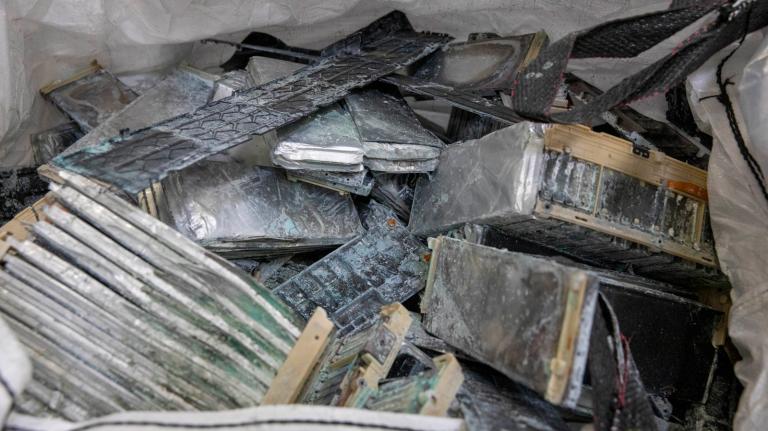Corroded and damaged electric vehicle batteries at the Ascend Elements electric vehicle recycling plant in Covington, Georgia, March 31, 2023.