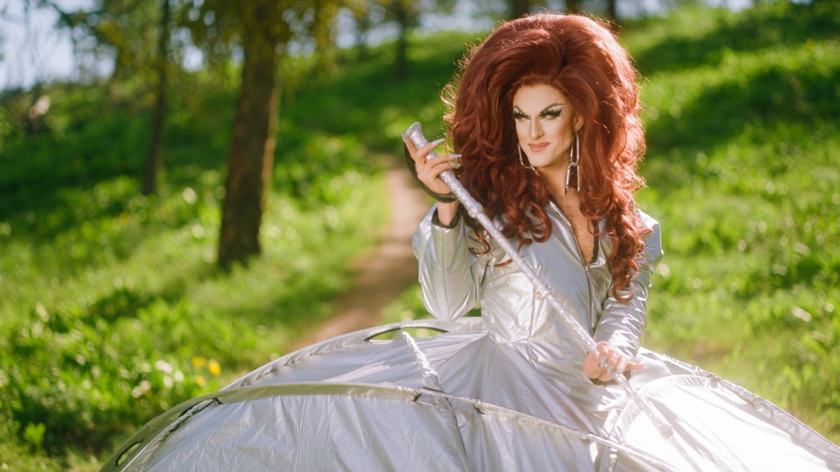 Environmentalist drag queen Pattie Gonia (pronounced like Patagonia) wears a silver dress that is also a tent