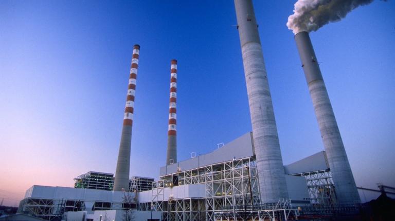 Smoke rises into a clear sky from the two smokestacks at the Tennessee Valley Authority's coal-powered power plant in Cumberland, Tennessee.