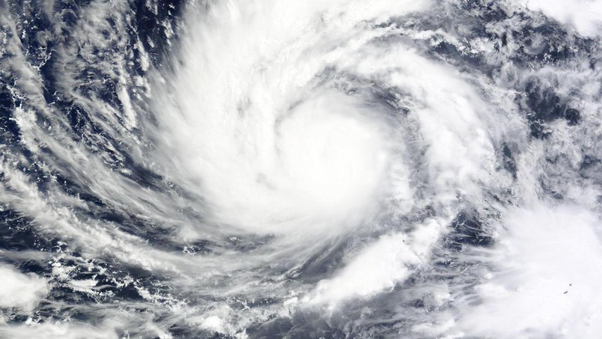 swirling clouds over blue sea