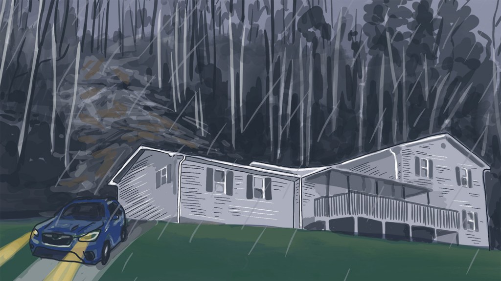 Rain pounds down on a wall of mud almost 8 feet tall that had slammed against the home’s vinyl siding.