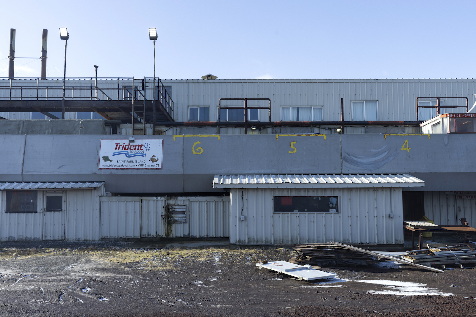 A run down building with a sign reading Trident Seafoods plant