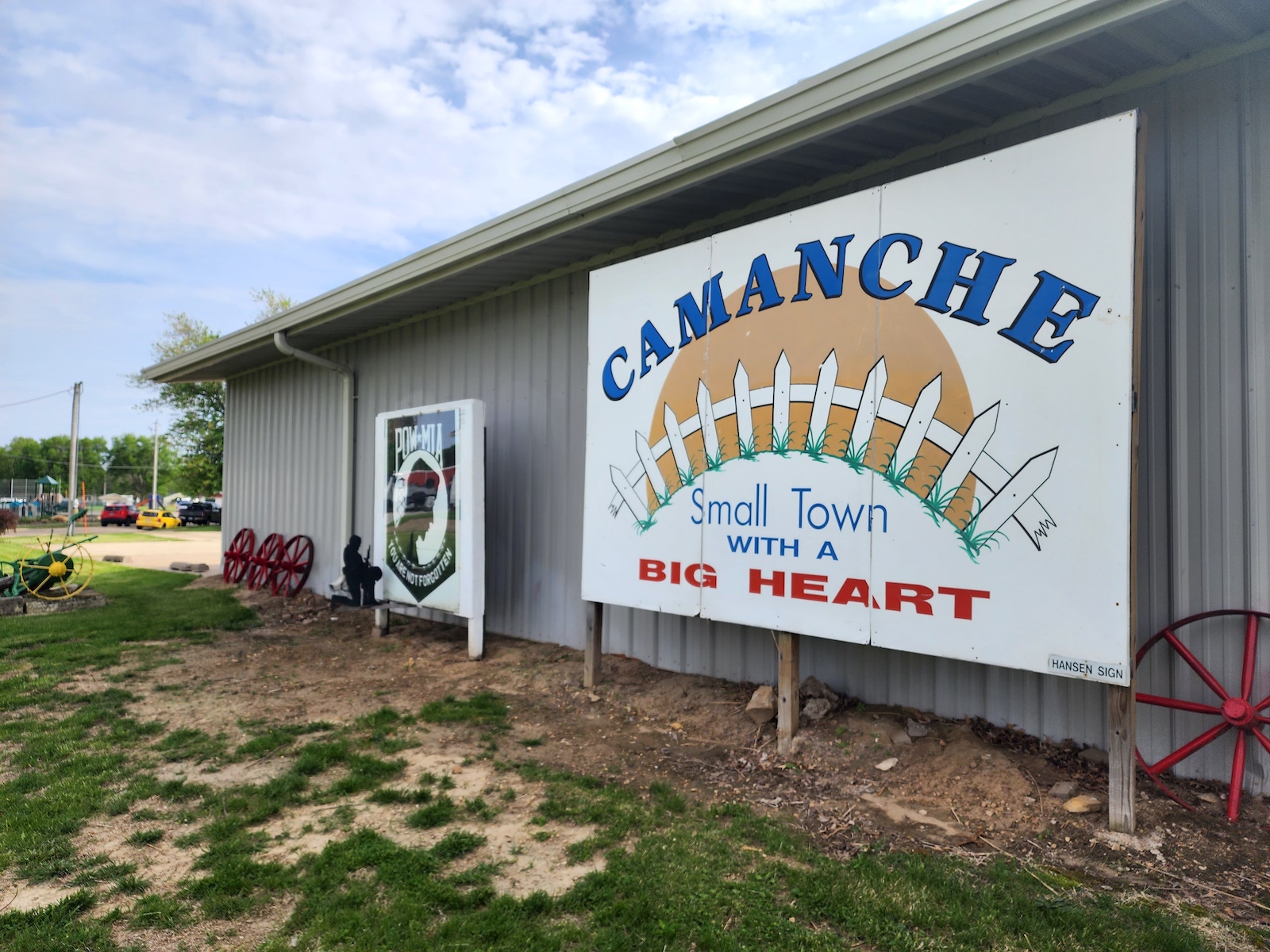 A sign says Camanche: A small town with big heart