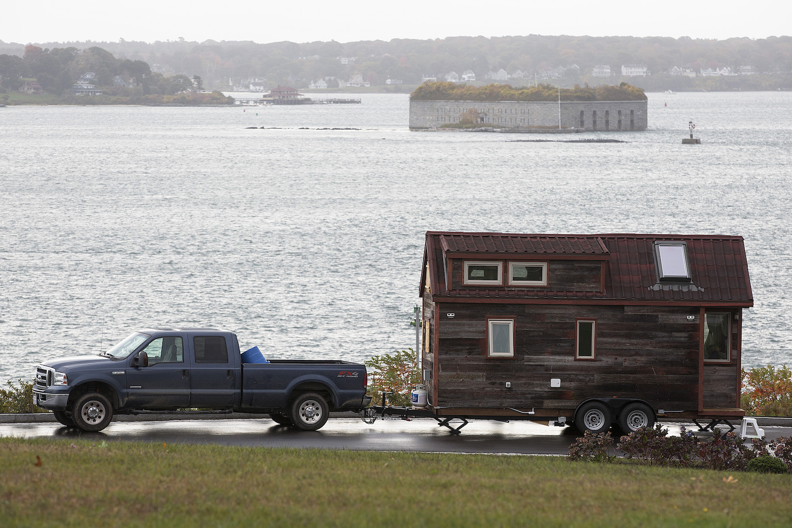 a truck pulling a tiny home on wheels