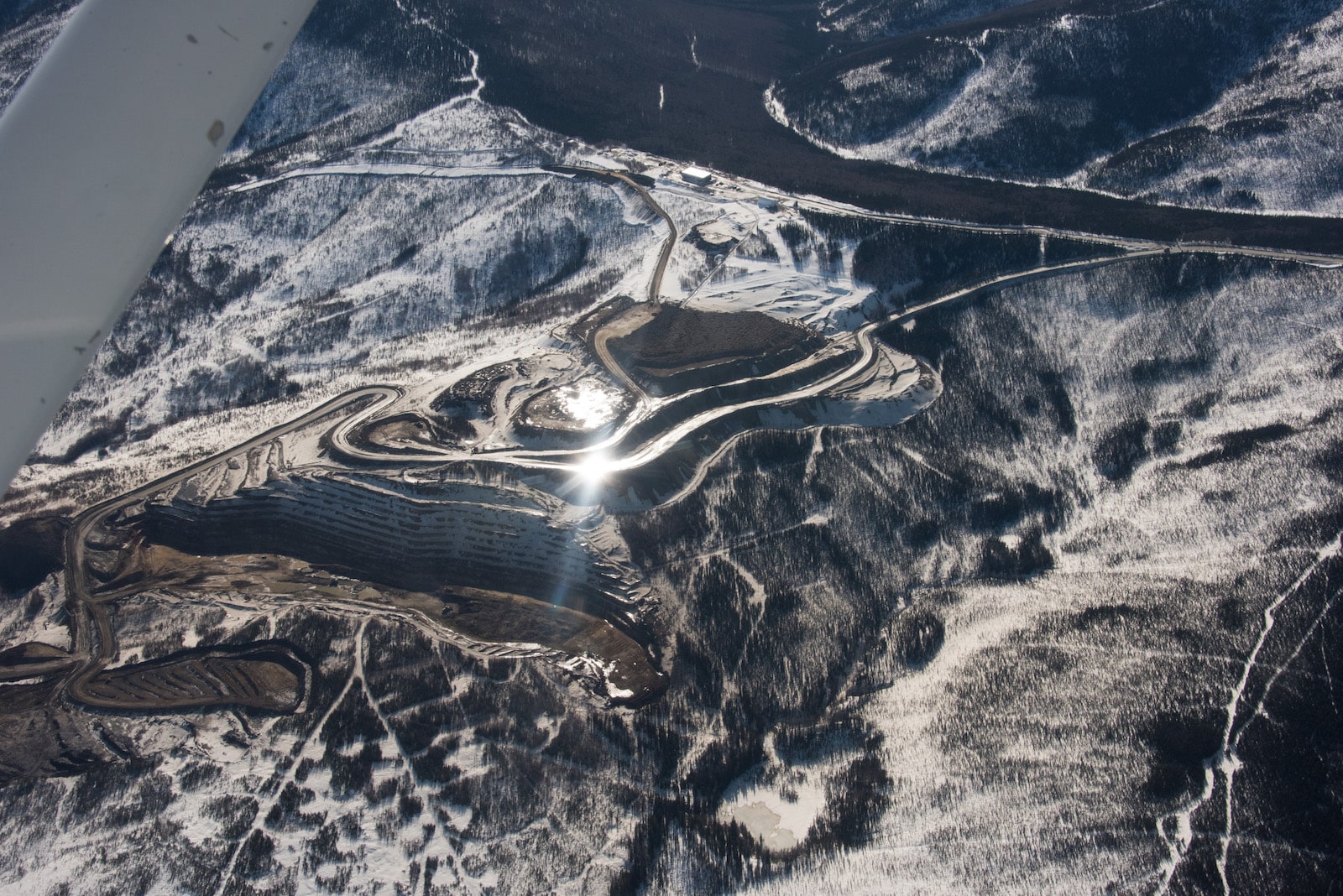 an airplane view of a brown and white mine