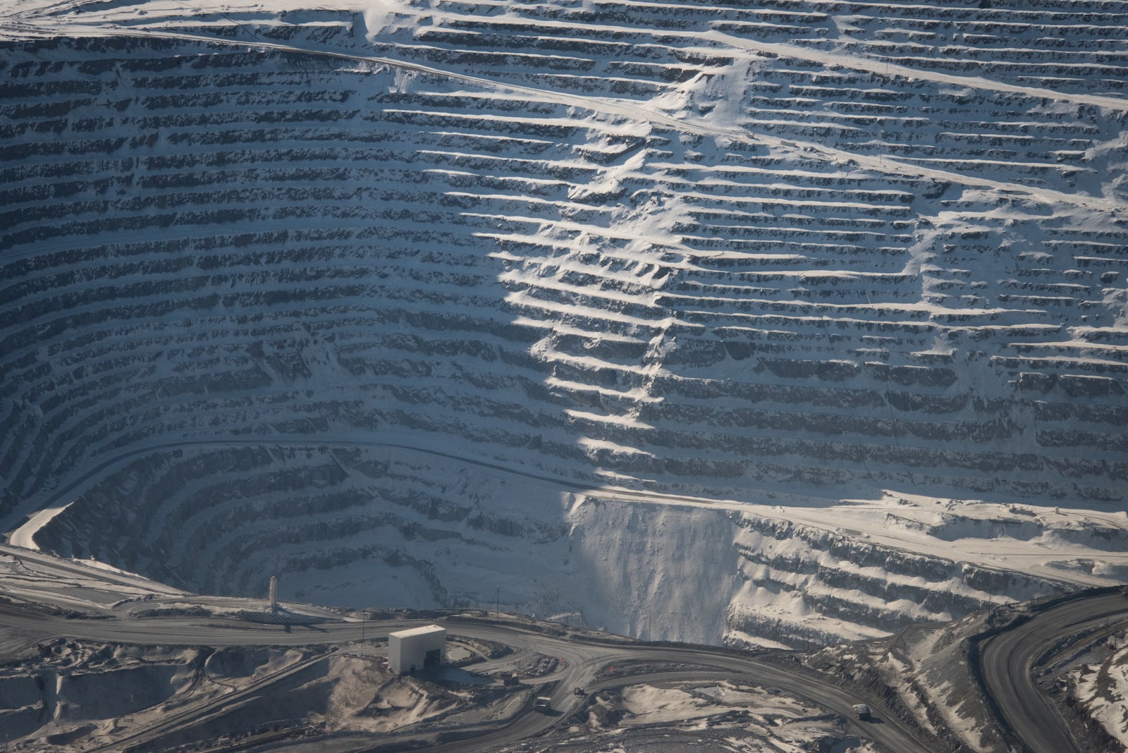 grooves cut into snowy ridges as part of a mine