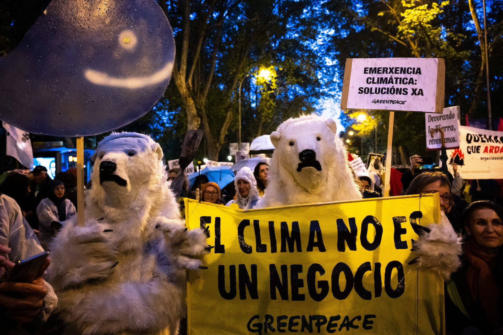 Two protesters dressed as polar bear are seen during a