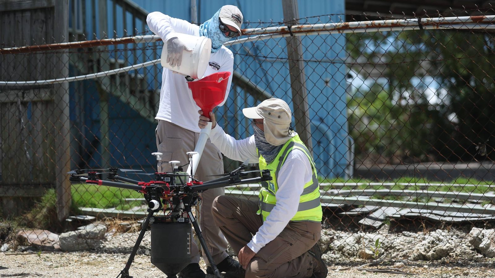 Workers from the Florida Keys' mosquito-control department