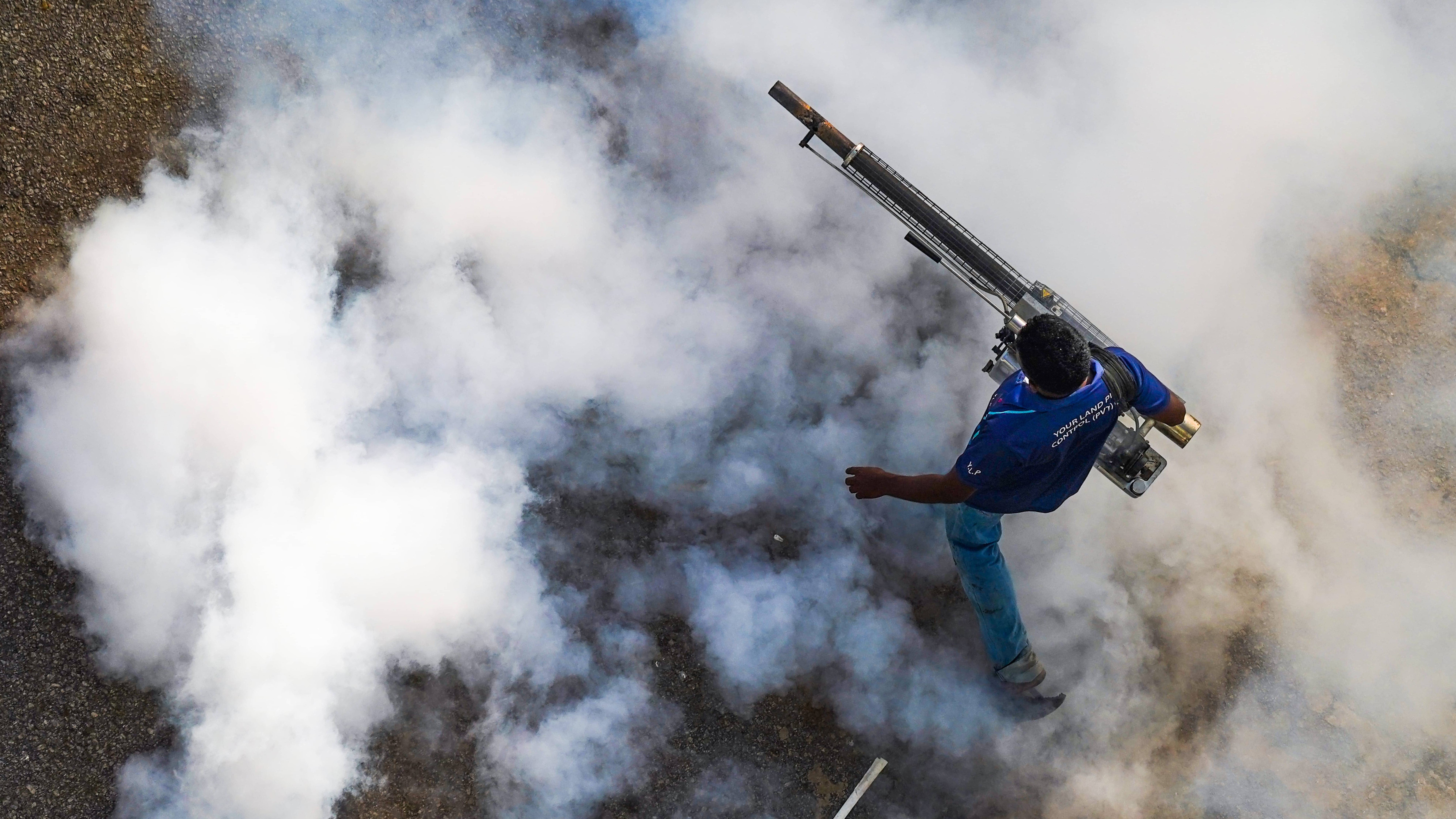 A health worker fumigating against dengue on July 28, 2023, in Colombo, Sri Lanka.