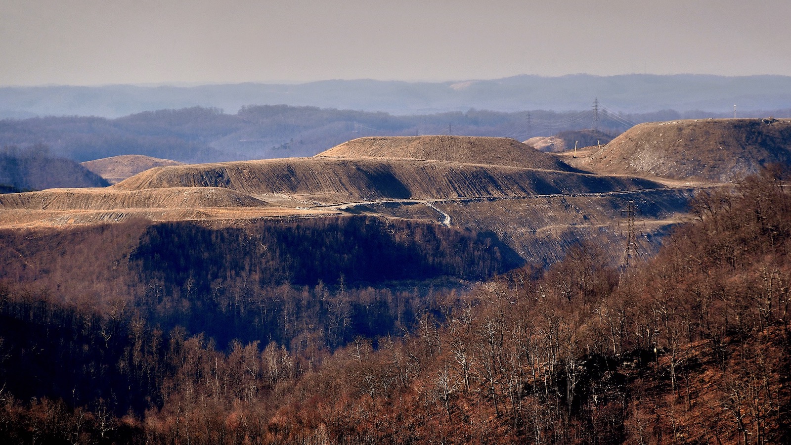 A panoramic shot shows a ridgeline in West Virginia leveled by mountaintop coal removal.