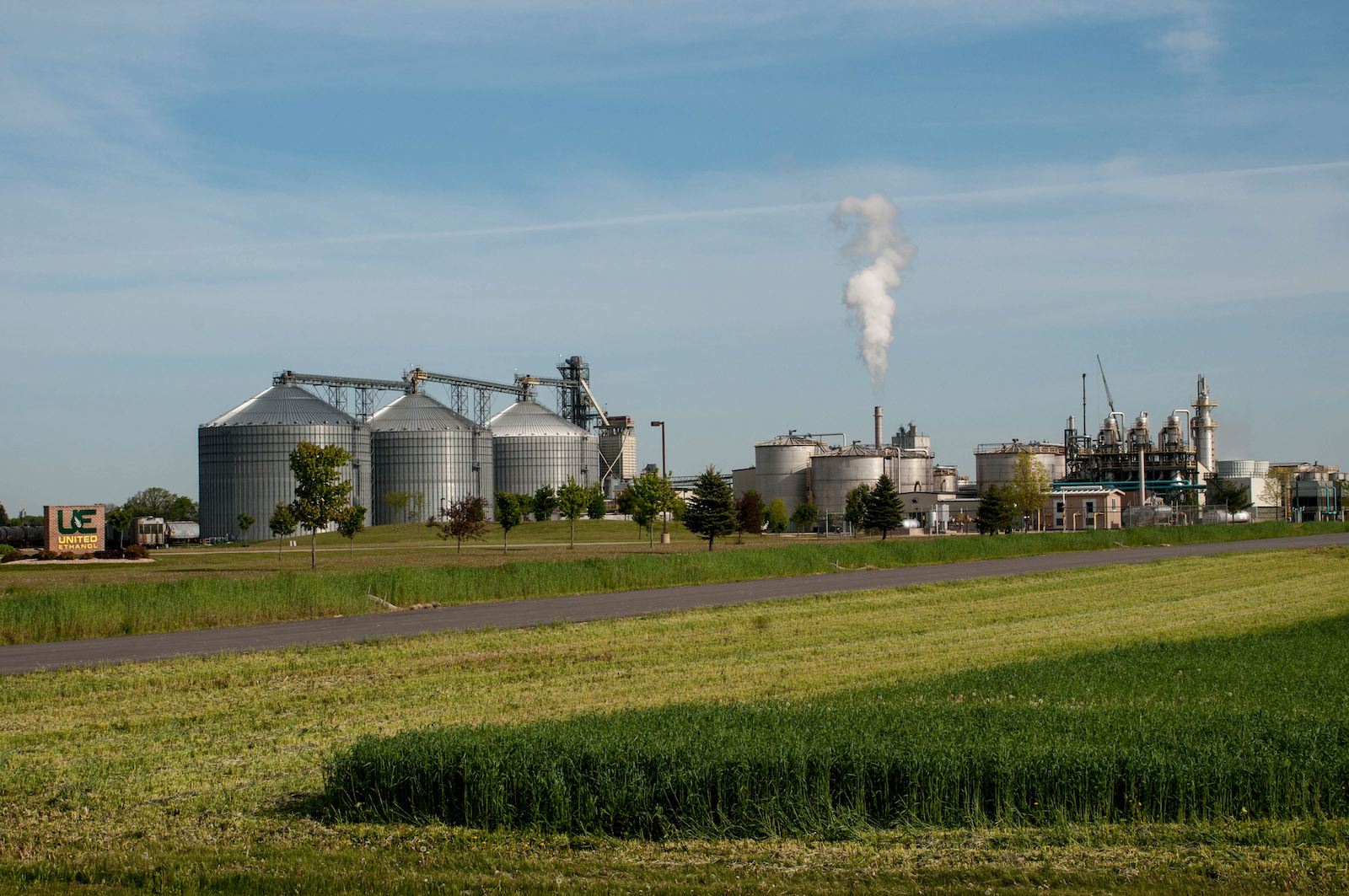View of an ethanol plant with field in foreground