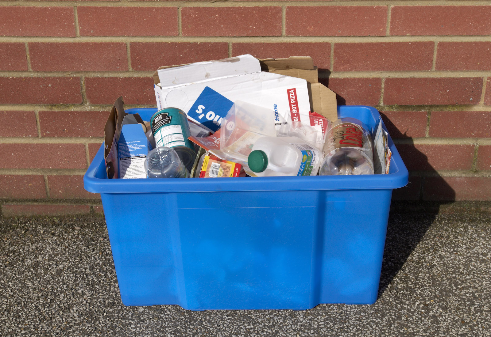 Blue recycling bin with mixed waste