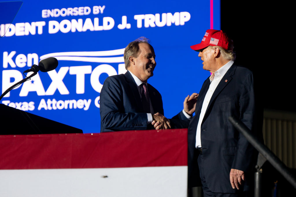 Paxton shakes Trump's hand