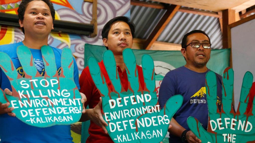 three men, teal hands