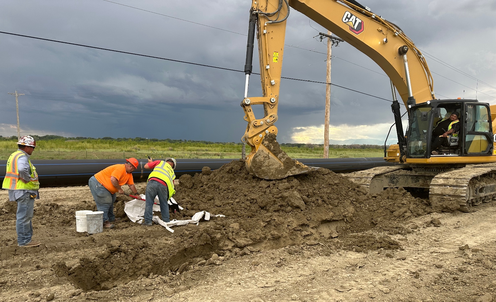Workers install a segment of pipeline near Pueblo, Colorado, as part of the Arkansas Valley Conduit project. The project is being funded by the bipartisan infrastructure bill Congress passed in 2021.