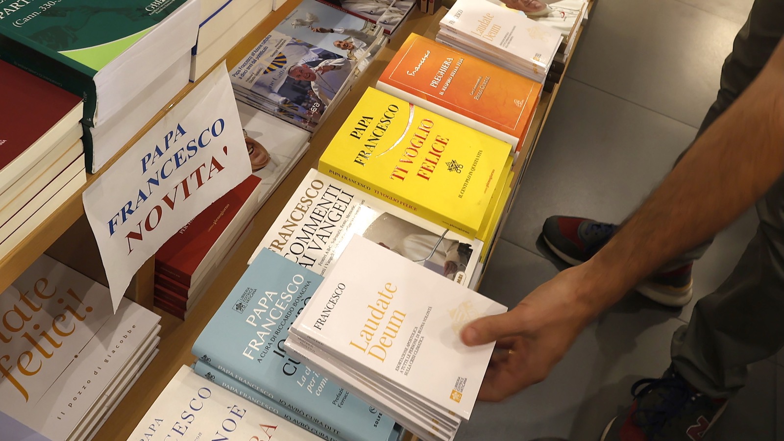 A bookseller displays a copy of Pope Francis' latest exhortaion, "Laudate Deum," for sale in a bookshop in Rome.