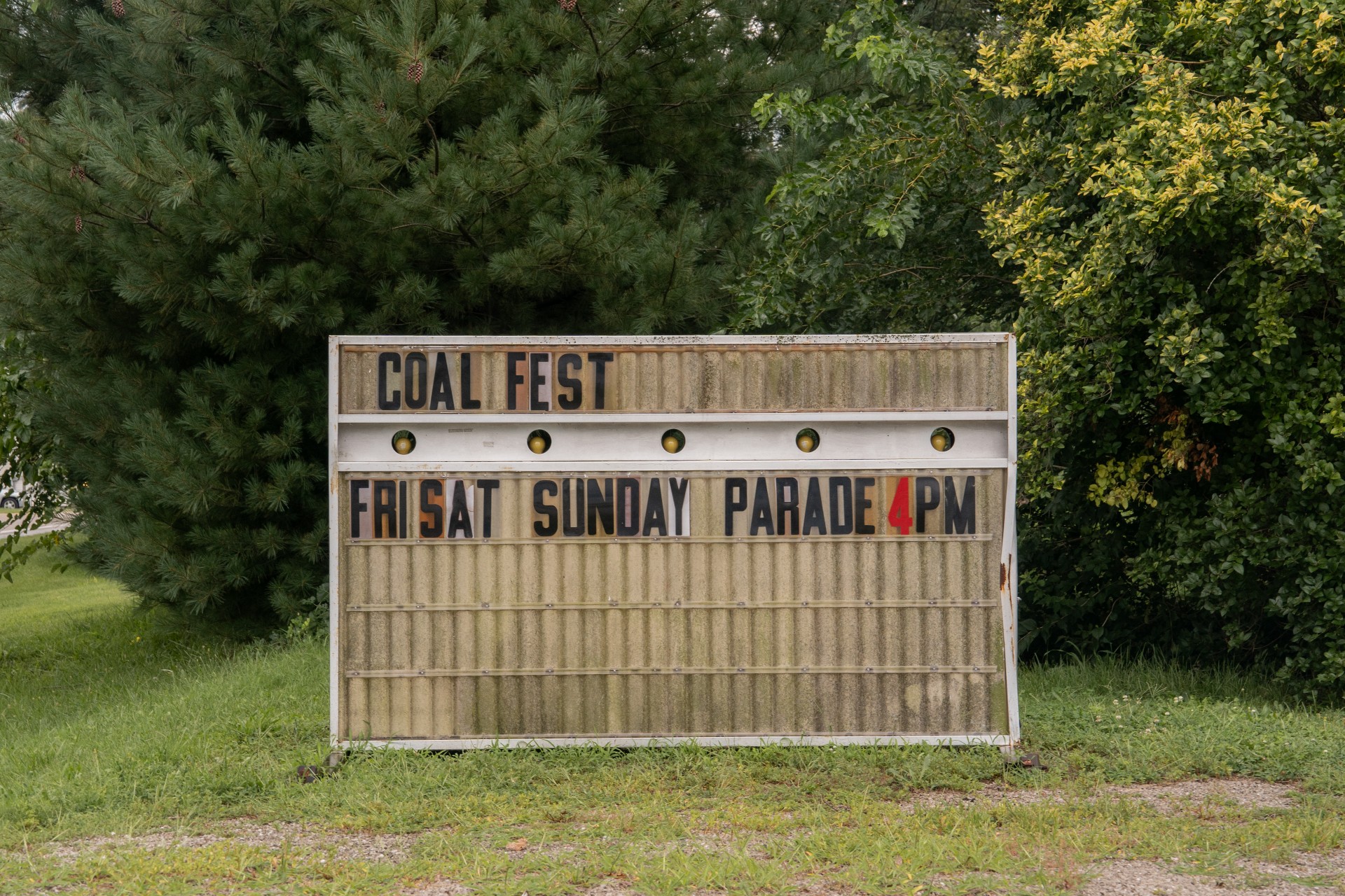 A sign reads: Coal Fest. Fri Sat Sunday Parade 4pm