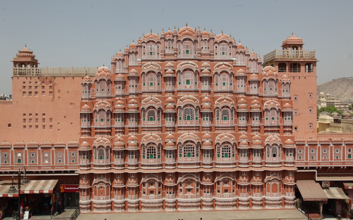 An ornate, brightly colored building facade with dozens of small windows.