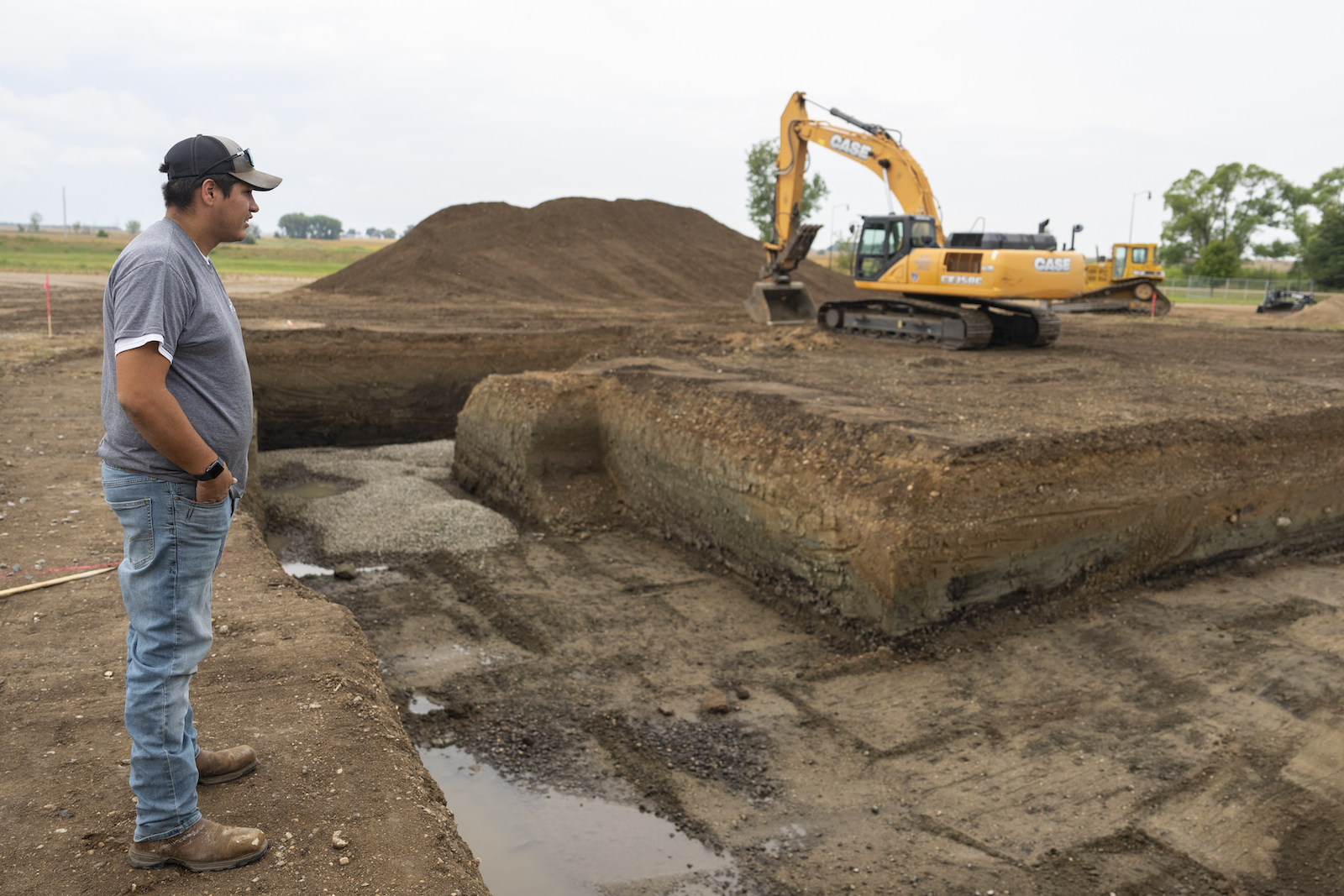 Joey Goodthunder, whose primary job is growing the tribe’s hemp, looks over the beginnings of a foundation for a building to house the tribe's processing equipment.