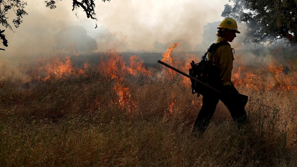 A firefighter monitors a controlled burn at Bouverie Preserve on May 30, 2017 in Glen Ellen, California.